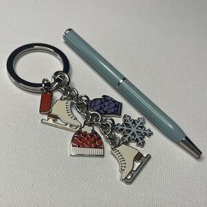 Coach Winter Charm Keychain with a Blue Coach Pen